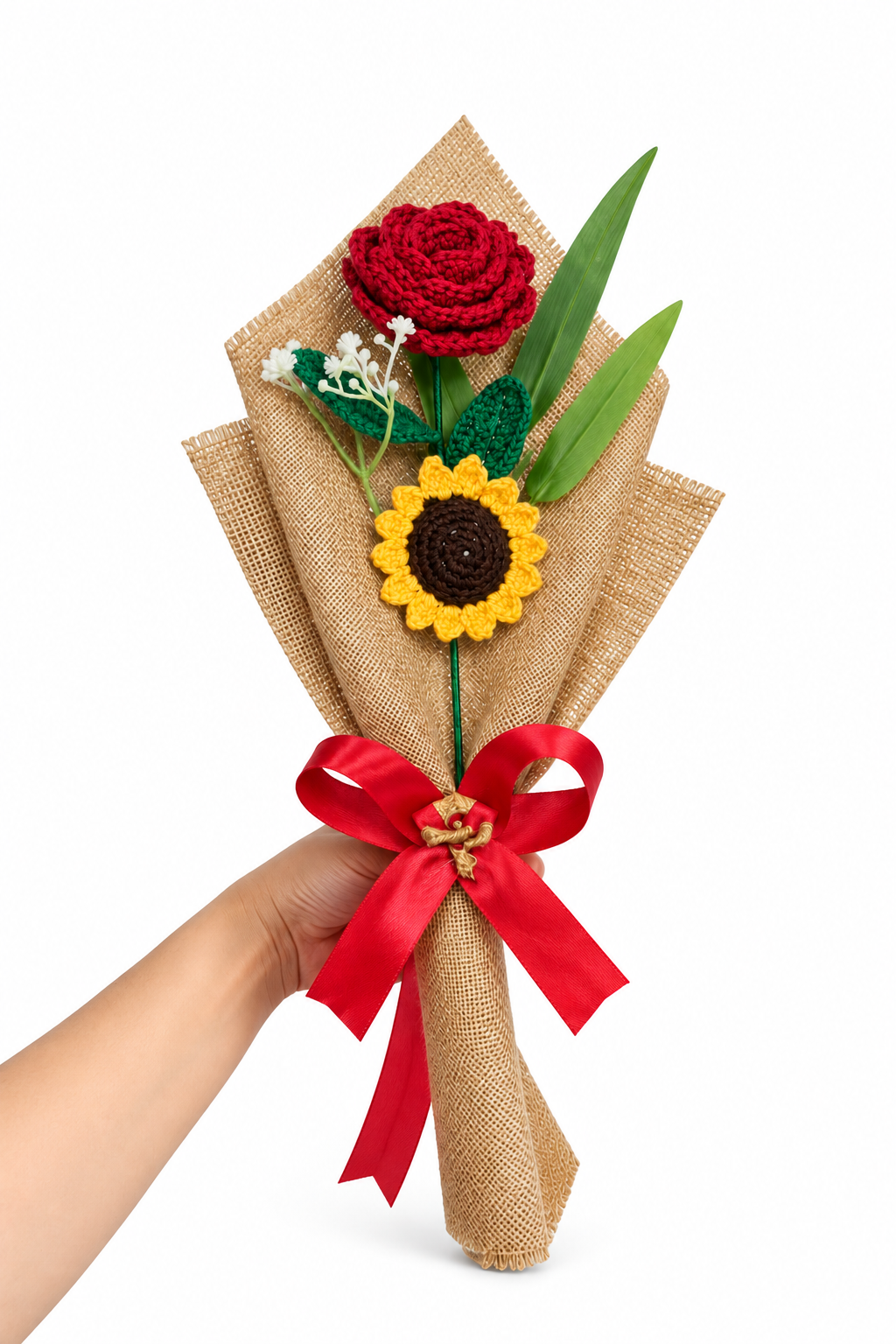 Handheld crochet bouquet with red rose, sunflower and white flowers wrapped in burlap and a red bow