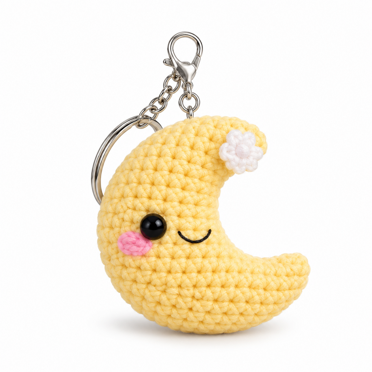 Yellow crocheted crescent moon keychain with flower detail