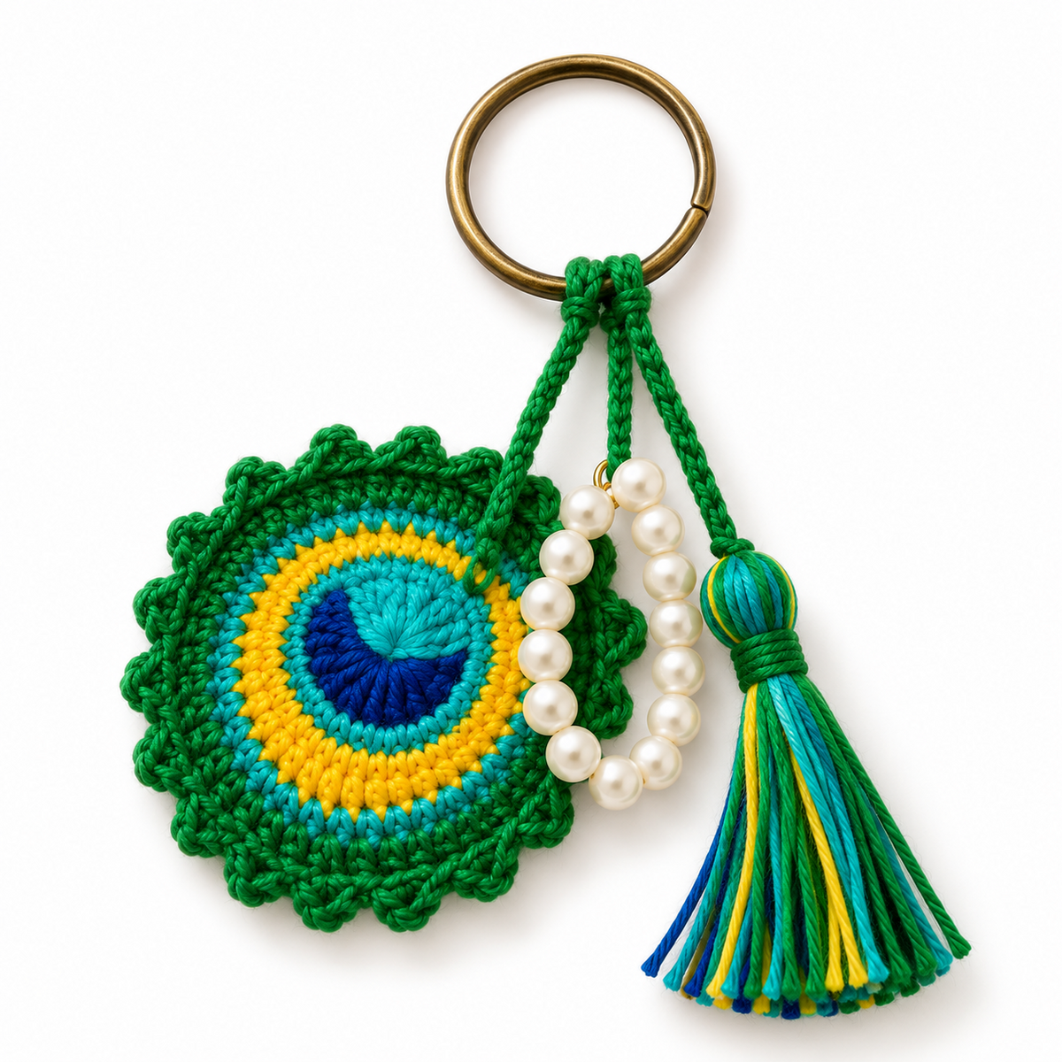 Green and blue crocheted peacock feather keychain with beads and tassel