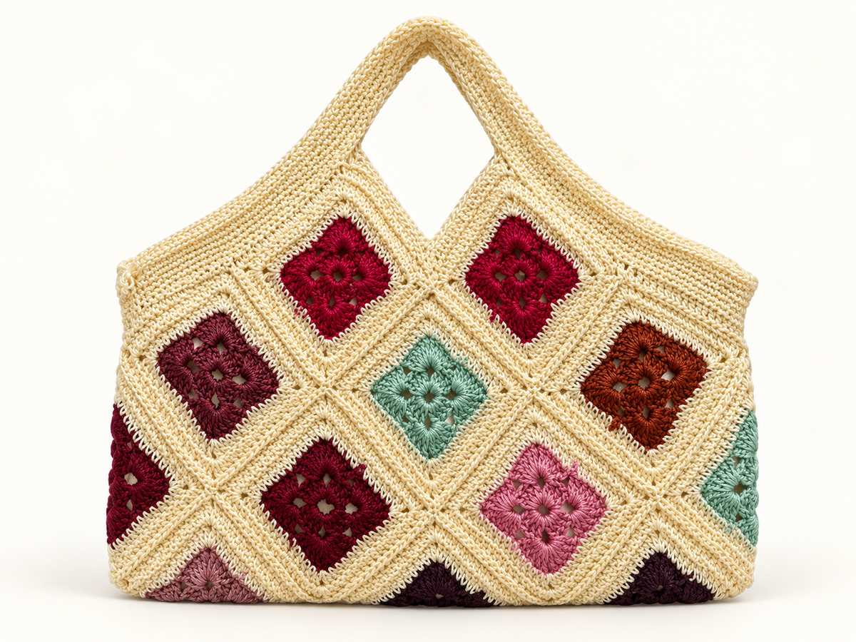 Cream crochet handbag with colorful granny-square floral motifs