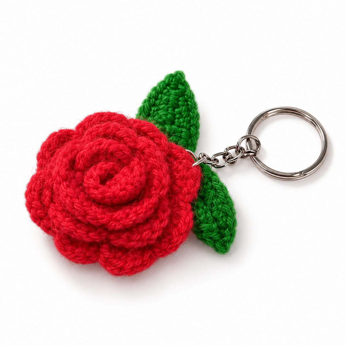Red crochet rose keychain with green leaves and silver metal key ring