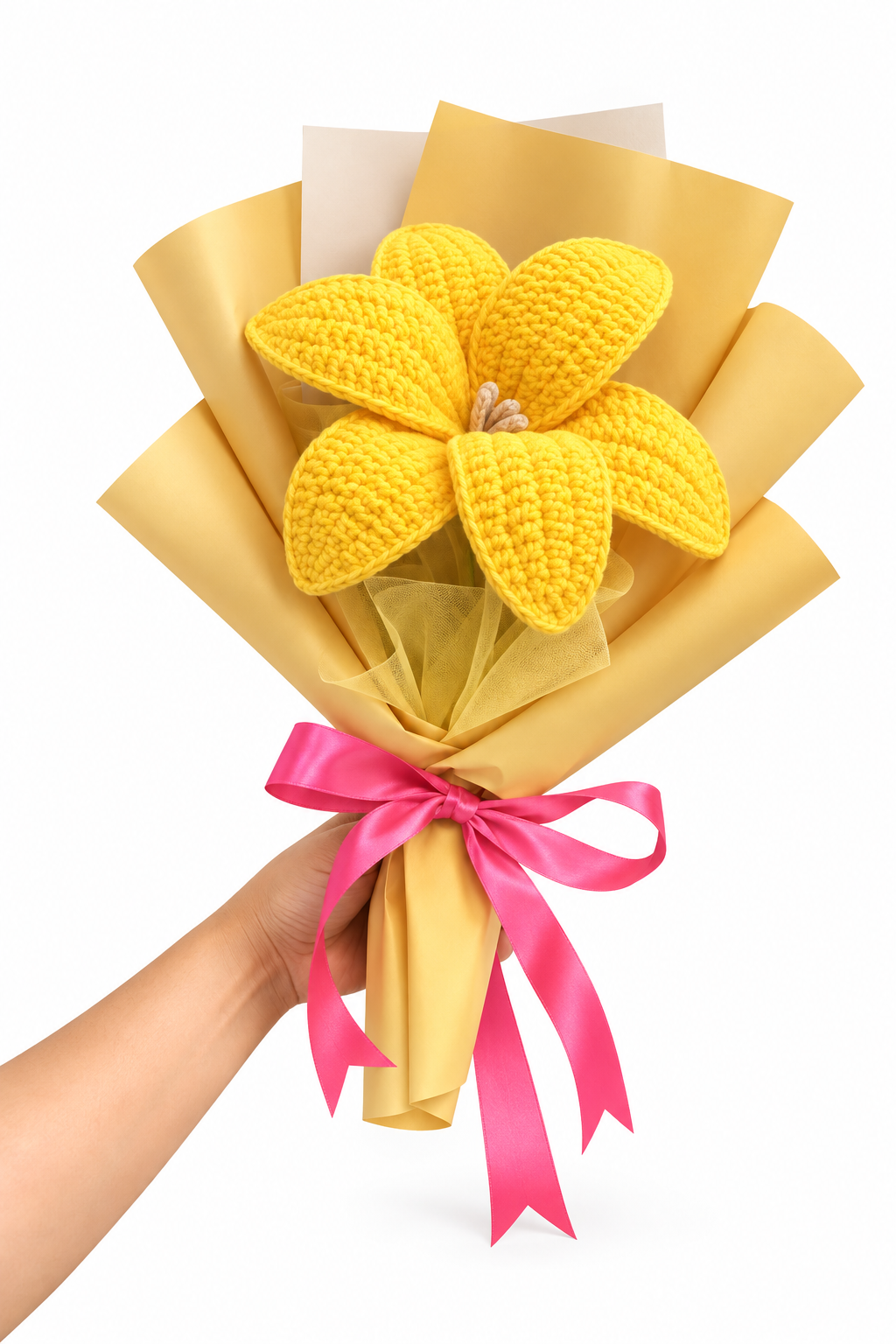 Handmade yellow crochet flower bouquet wrapped in golden yellow paper with a pink satin bow