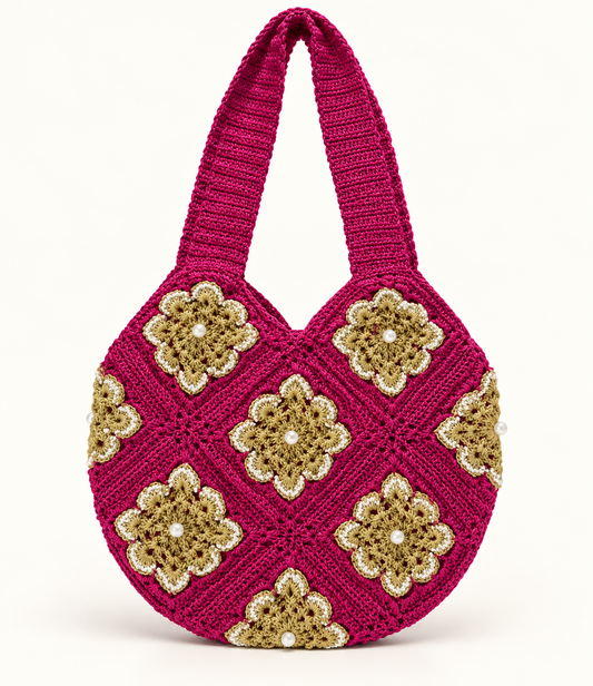 Magenta crochet shoulder tote with gold floral granny-square motifs and pearl accents
