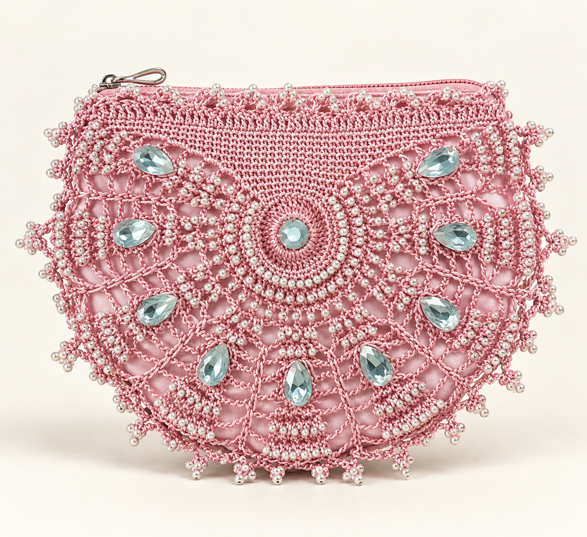 Ornate pink beaded crochet clutch with pearl embellishments and pale blue gemstones