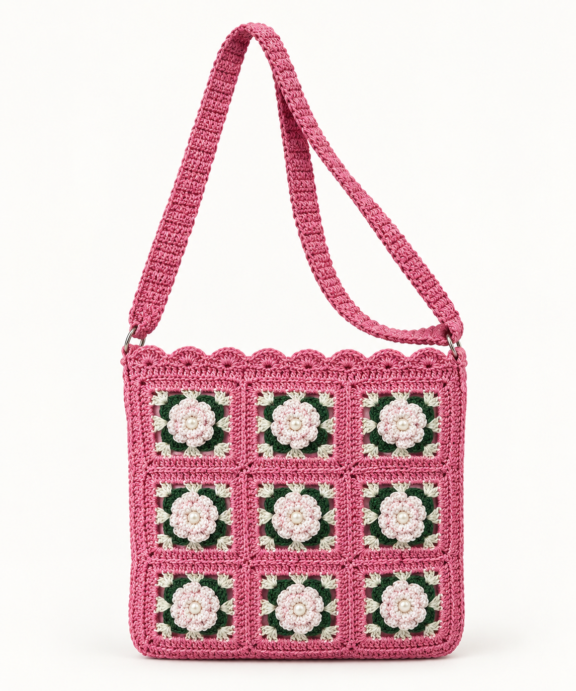 Pink handmade crochet shoulder bag with cream floral granny-square panels and pearl centers
